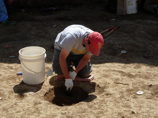 Removing soil from last years test hole