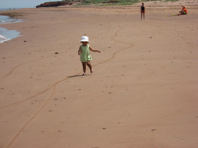 Lily running on beach