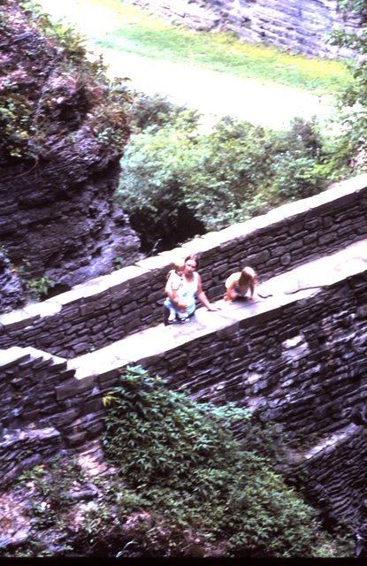 Cindy holding Scott, Kim climbing wall at Watkins Glen