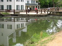 NPS people lowering boat in lock #20