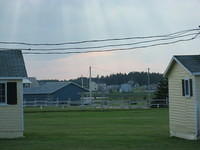 Sun rays between two of the old cottages