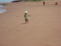 Lily running on beach