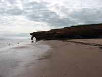 Red sandstone cliffs at Penderosa Beach (leaning part now gone)